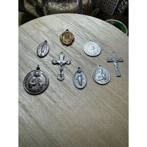 Collection of vintage religious medals and a crucifix